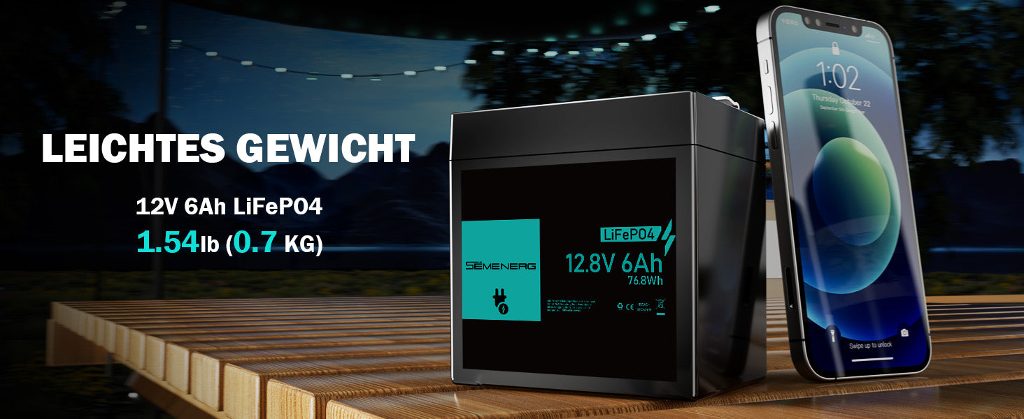 Battery pack with smartphone on a wooden surface, dark background